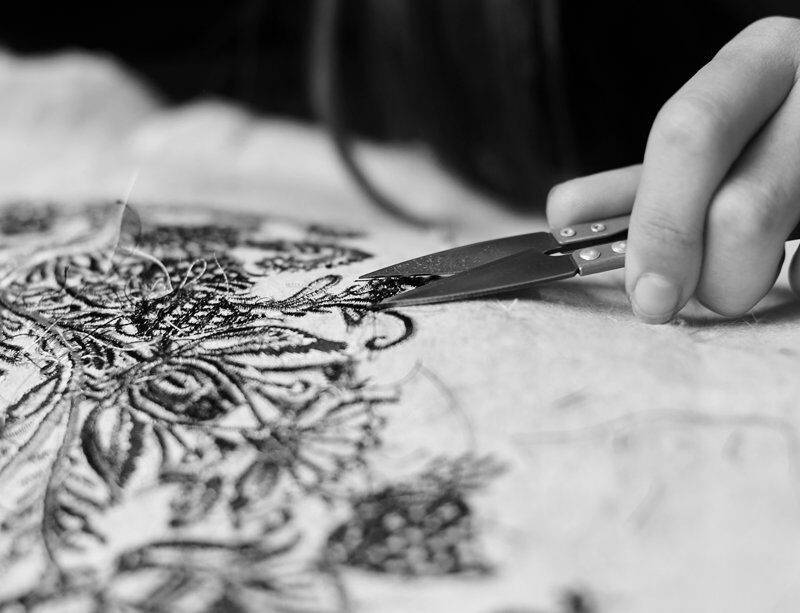 close-up-woman-worker-hand-cutting-away-short-loose-ends close-up-woman-worker-hand-cutting-away-short-loose-ends